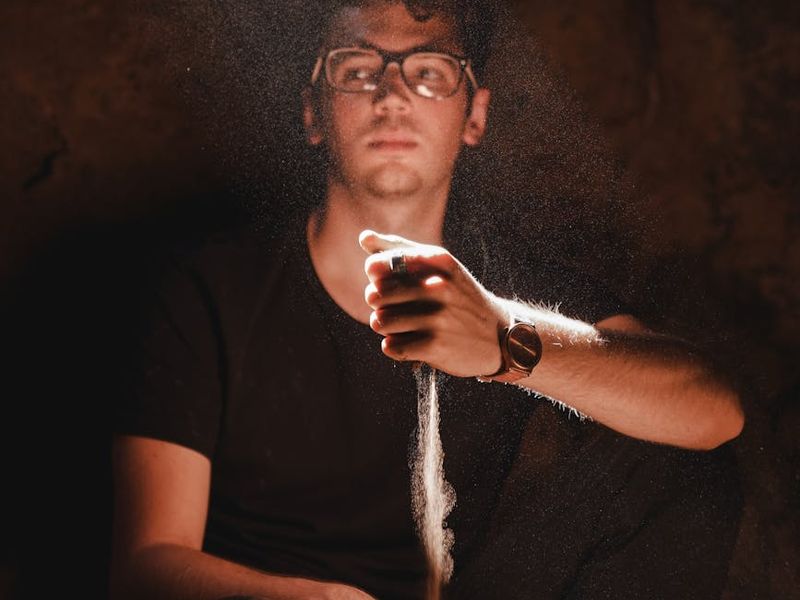 Close-up of a person's hands in a meditative pose.